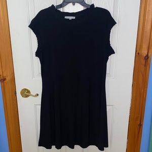 Little Black Dress with cute ruffle detail on cap sleeve and neckline.